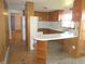 Cozy kitchen featuring wood cabinets and a breakfast bar, perfect for casual dining at 210 Evergreen St, Morgantown, IN 46160