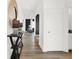Inviting hallway with sleek floors, and a stylish console table with decorative mirror to create a welcoming atmosphere at 2218 Boxwood Dr, Greenfield, IN 46140
