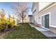 Backyard featuring a white fence, green bushes, grass and the side of the home at 2352 Somerset Cir, Franklin, IN 46131