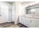 Bathroom with double sink vanity, quartz countertop, white cabinets, and tiled flooring at 2352 Somerset Cir, Franklin, IN 46131