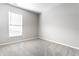 Bedroom with a window providing natural light, neutral paint, and plush carpet at 2352 Somerset Cir, Franklin, IN 46131