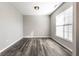 A brightly lit empty room with hard wood floors and a large window at 2352 Somerset Cir, Franklin, IN 46131