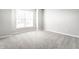 Bedroom with a window providing natural light, neutral paint, and plush carpet at 2352 Somerset Cir, Franklin, IN 46131