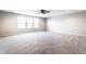 Spacious bonus room features neutral paint, carpet, recessed lighting, a fan, and windows at 2352 Somerset Cir, Franklin, IN 46131