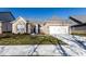 Inviting single-story home featuring a brick facade, attached two-car garage, and well-maintained lawn at 2352 Somerset Cir, Franklin, IN 46131