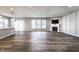 Spacious living area with fireplace, large windows, and wood-look flooring, offering ample natural light at 2352 Somerset Cir, Franklin, IN 46131