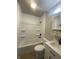 Clean bathroom with white vanity, medicine cabinet, and tub/shower combo with white tile surround at 238 N 7Th Ave, Beech Grove, IN 46107