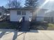 Charming single-story home featuring a ramp for easy access and a cozy front deck at 238 N 7Th Ave, Beech Grove, IN 46107