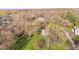 Aerial view of the property showcasing mature trees, landscaping, and surrounding neighborhood at 241 Melissa Ann Ct, Indianapolis, IN 46234