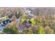 Aerial view of the property with landscaping, mature trees, and a lush green lawn at 241 Melissa Ann Ct, Indianapolis, IN 46234