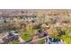 Aerial view of the home nestled in a mature, tree-filled neighborhood at 241 Melissa Ann Ct, Indianapolis, IN 46234