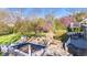 Inviting backyard features an in-ground pool, mature trees, and a charming gazebo area; needs some TLC at 241 Melissa Ann Ct, Indianapolis, IN 46234