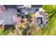 Aerial shot of the backyard with a patio, pond, and landscaped garden at 241 Melissa Ann Ct, Indianapolis, IN 46234