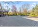 Large backyard with a concrete area and lush trees in a desirable location at 241 Melissa Ann Ct, Indianapolis, IN 46234