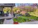 A beautiful backyard with a patio, pond, stone walkway, and landscaping at 241 Melissa Ann Ct, Indianapolis, IN 46234