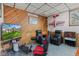 Gaming area in the finished basement has wood paneled accent wall at 241 Melissa Ann Ct, Indianapolis, IN 46234