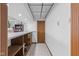 Basement area features tile floors, storage shelves, and neutral color scheme for flexible use at 241 Melissa Ann Ct, Indianapolis, IN 46234