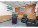 Basement gaming area with two recliners and racing style video chair at 241 Melissa Ann Ct, Indianapolis, IN 46234