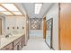 Well-lit bathroom with white tile, vanity, and a framed mirror at 241 Melissa Ann Ct, Indianapolis, IN 46234