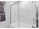 Elegant bathroom featuring a sleek shower with marble-like tiles and glass doors at 241 Melissa Ann Ct, Indianapolis, IN 46234