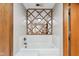 Bathroom features white tile, decorative mirror, and a soaking tub at 241 Melissa Ann Ct, Indianapolis, IN 46234