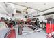 Spacious garage with ample lighting, various tools, and equipment, perfect for projects and storage at 241 Melissa Ann Ct, Indianapolis, IN 46234