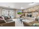 Cozy living room with stone fireplace, plush seating, and glass coffee table at 241 Melissa Ann Ct, Indianapolis, IN 46234