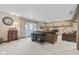 Cozy living room features a stone fireplace, vintage decor, and walk-out access to patio at 241 Melissa Ann Ct, Indianapolis, IN 46234