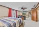 Spacious main bedroom with wood trim, ceiling fan, doors to balcony, and connecting living area at 241 Melissa Ann Ct, Indianapolis, IN 46234