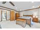 Large main bedroom with seating area, wood trim, and plenty of closet space at 241 Melissa Ann Ct, Indianapolis, IN 46234