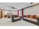 Oversized bedroom featuring ceiling fan, seating area, balcony access, and open layout at 241 Melissa Ann Ct, Indianapolis, IN 46234