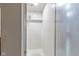 Shower featuring tiled walls and a frosted glass door at 241 Melissa Ann Ct, Indianapolis, IN 46234