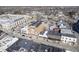 Wide aerial shot displaying a mixed-use urban area with residential and commercial buildings and ample parking at 30 W Main St # 3D, Carmel, IN 46032
