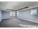 Bright and airy bedroom with tray ceiling, large windows for natural light, neutral gray walls, and open layout at 30 W Main St # 3D, Carmel, IN 46032