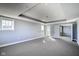 Bright and airy bedroom with neutral gray walls, large windows for natural light, and open layout at 30 W Main St # 3D, Carmel, IN 46032