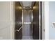 A modern home elevator with stainless steel accents and safety features for easy accessibility at 30 W Main St # 3D, Carmel, IN 46032