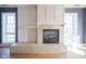 A cozy marble fireplace provides a warm focal point in this inviting living space at 30 W Main St # 3D, Carmel, IN 46032