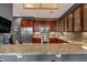 Modern kitchen featuring stainless steel appliances, granite countertops, and custom cabinetry at 30 W Main St # 3D, Carmel, IN 46032