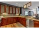 Stylish kitchen featuring granite countertops, stainless steel appliances, and custom wood cabinets at 30 W Main St # 3D, Carmel, IN 46032