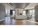 Bright living room features a fireplace, recessed lighting, and hardwood floors at 30 W Main St # 3D, Carmel, IN 46032