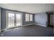 Living room with french doors, neutral carpet and gray walls at 30 W Main St # 3D, Carmel, IN 46032