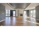 Spacious living room with a decorative fireplace and an abundance of natural light at 30 W Main St # 3D, Carmel, IN 46032