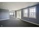 Living room with french doors, neutral carpet and gray walls at 30 W Main St # 3D, Carmel, IN 46032