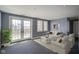 Living room with french doors, neutral carpet and white furniture at 30 W Main St # 3D, Carmel, IN 46032