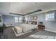 Spacious main bedroom suite featuring a tray ceiling, soft lighting, and neutral tones for a serene, welcoming space at 30 W Main St # 3D, Carmel, IN 46032