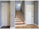 Staircase with wood stairs, gray walls and white trim at 30 W Main St # 3D, Carmel, IN 46032