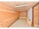 Unfinished basement featuring wooden walls and ceiling with bright overhead lighting at 302 S Sherman Dr, Indianapolis, IN 46201