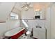 A charming bathroom with a red clawfoot tub and black and white tile at 302 S Sherman Dr, Indianapolis, IN 46201