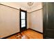 Bedroom with wood flooring, light walls, and dark window and ceiling trim at 302 S Sherman Dr, Indianapolis, IN 46201