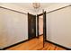 Bedroom with dark trim, chandelier lighting, and hardwood floors at 302 S Sherman Dr, Indianapolis, IN 46201